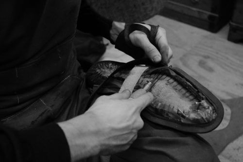 Man working on the sole of a shoe