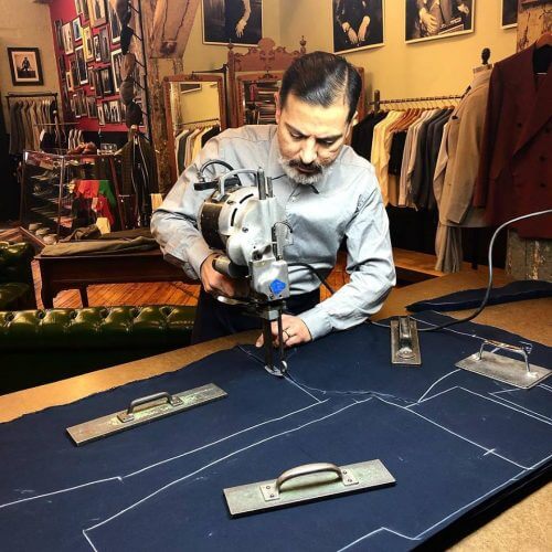 Robinson cutting out fabric