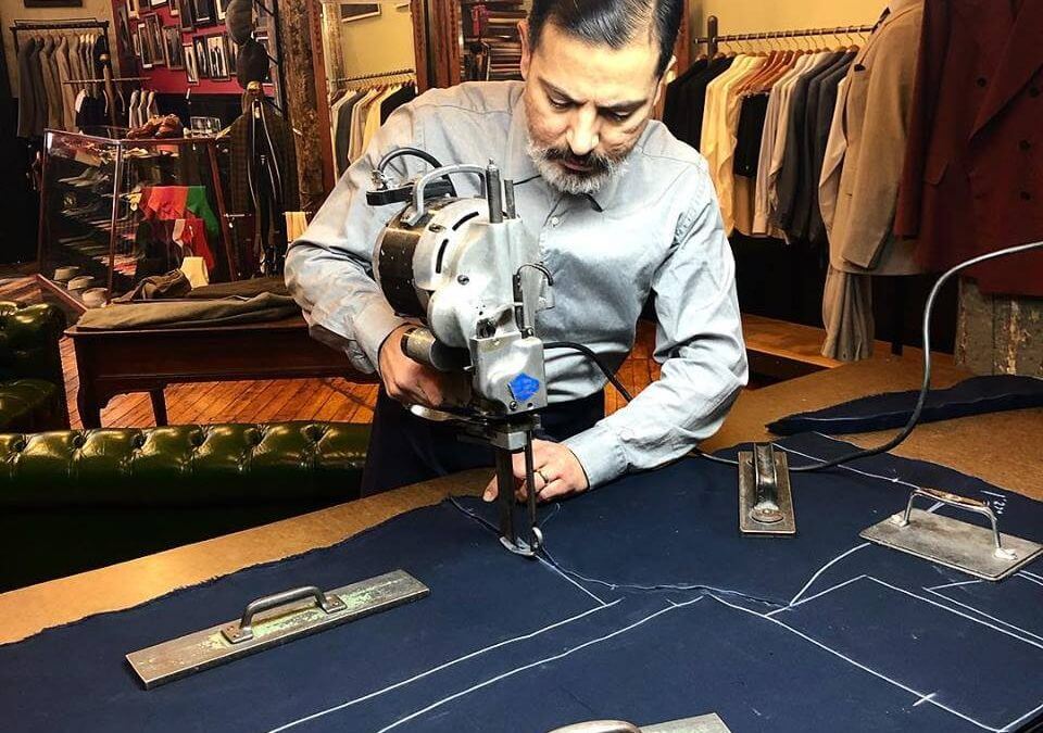Robinson cutting out fabric