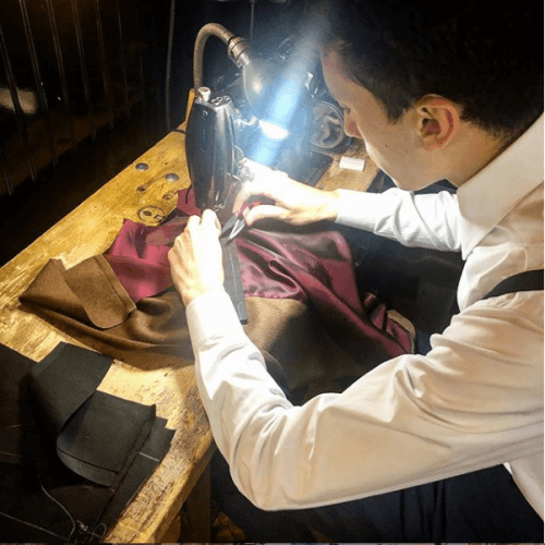 Tailor using a sewing machine