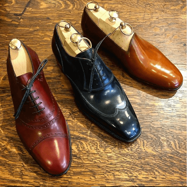 Three different colors and types of dress shoes