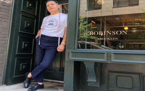 Robinson in front of store window