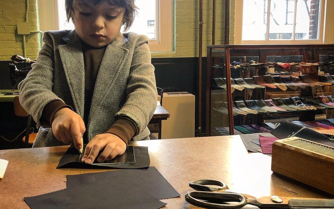 Young kid practicing their tailoring