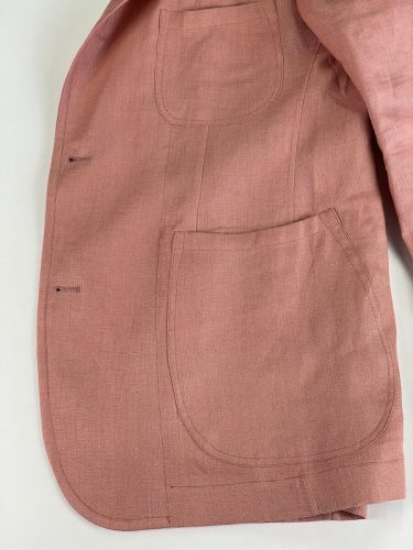 Side pocket view of salmon suit jacket