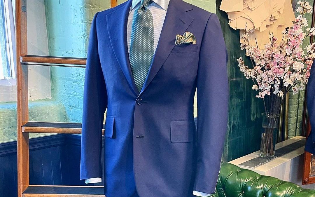 A navy blue suit on display